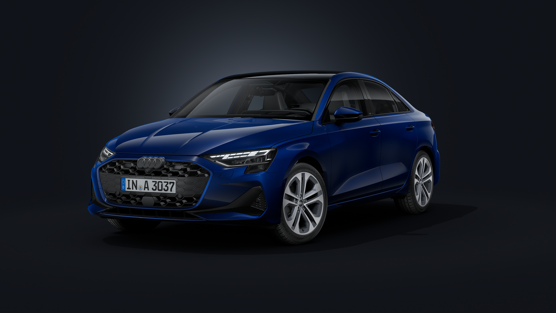 Die Audi A3 Limousine schräg von vorne auf dunklem Hintergrund.